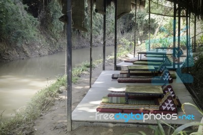 Outdoors Seats Beside The Creek In Summer Stock Photo