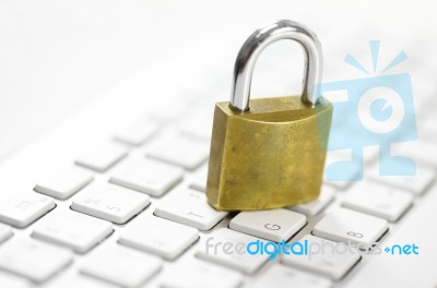 Padlock On White Keyboard Network Security Conception Stock Photo