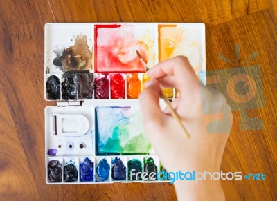 Paintbrush And Paint Palette Stock Photo