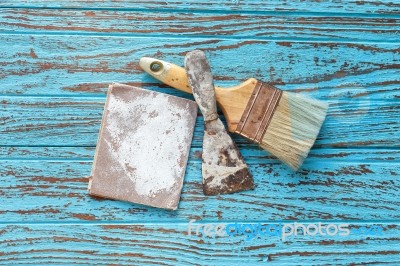 Paintbrush  Trowel Sandpaper  Still Life Wood Teak Table Antique… Stock Photo