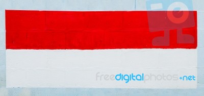 Painting Flag Of Indonesia On Wall Stock Photo