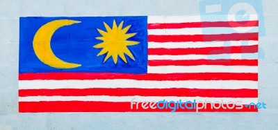 Painting Flag Of Malaysia On Wall Stock Photo