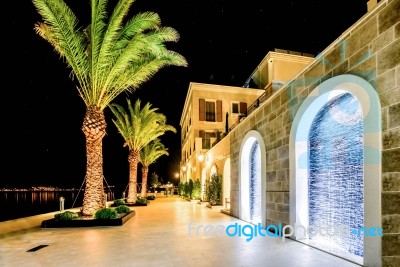 Palm Trees And The Buildings In The Night Lights In Marina Porto Montenegro, Tivat, Montenegro Stock Photo