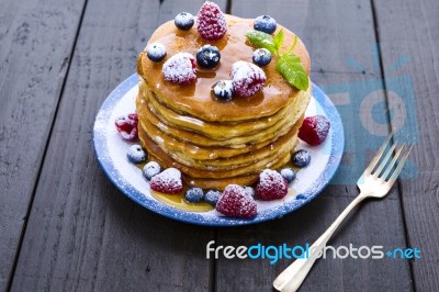 Pancakes With Honey And Berries Stock Photo