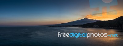 Panoramic View Of Mount Etna And The Coast Of Taormina Stock Photo