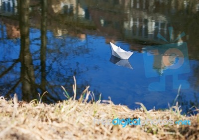 Paper Boat Floating In The Creek Stock Photo