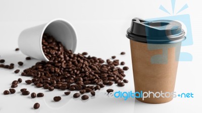 Paper Coffee Cup With Coffee Beans Stock Photo