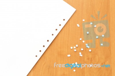 Paper With Holes On The Office Table Stock Photo
