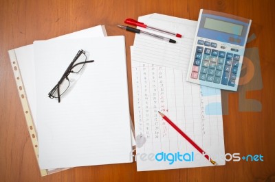 Papers On Table With Calculator Stock Photo