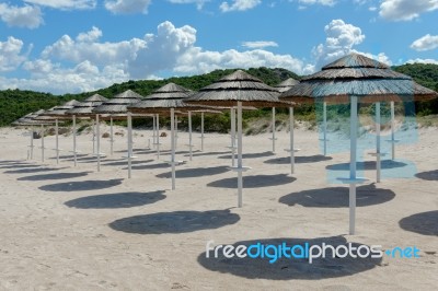 Parasols At Liscia Ruja Beach In Sardinia Stock Photo