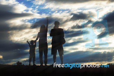 Parents And Children With Silhouettes Stock Photo