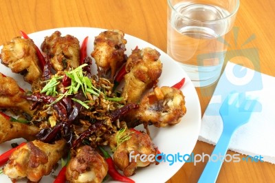 Part Of Spicy Herb Fried Chicken Wings On The Table Stock Photo