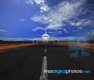 Passenger Air Plane Running On Airport Runway With Beautiful Blu… Stock Photo