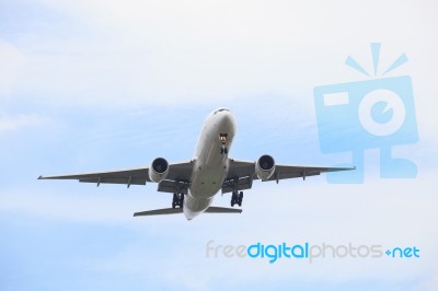 Passenger Jet Plane Flying Against Beautiful Blue Sky With Copy Stock Photo