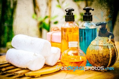 Pastel Spa Oils In Bottles On Wooden Table And Nature Background… Stock Photo