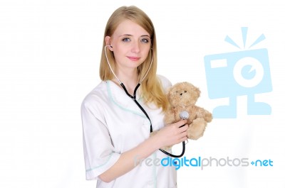 Pediatrician Examining Teddy Bear Stock Photo