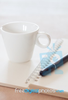 Pen And Spiral Notebook With Coffee Cup Stock Photo