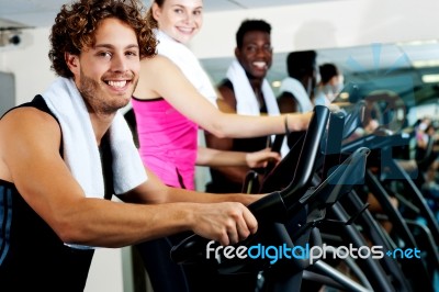 People At  Gym Working Out Happily Stock Photo