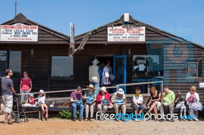 People Enjoying Fish And Chips In Southwold Stock Photo