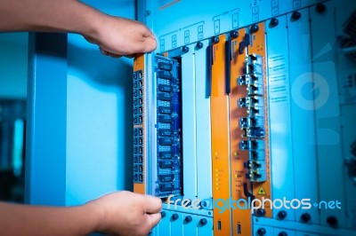 People Fix Core Switch In Network Room Stock Photo