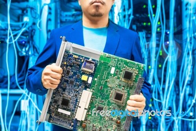 People Fix Core Switch In Network Room Stock Photo