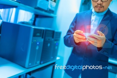 People Use Smart Phone In Datacenter Room Stock Photo