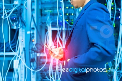 People Use Smart Phone In Datacenter Room Stock Photo