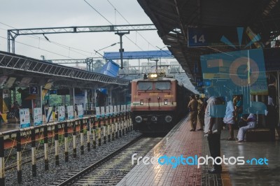 People Watching As A Train Approaches Stock Photo