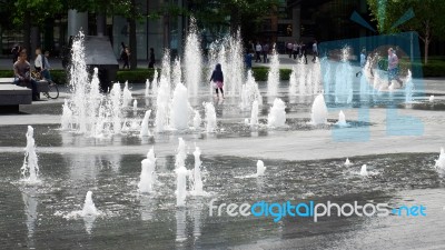Person Standing In The Middle Of A Fountain In London Stock Photo