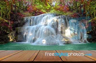Perspective Window View Of Waterfall With Autumn Forest Stock Photo