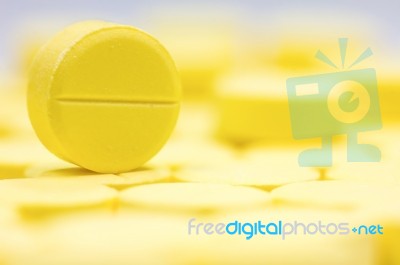 Pharmacy Theme, Heap Of Yellow Round Medicine Tablet Antibiotic Pills. Shallow Dof Stock Photo
