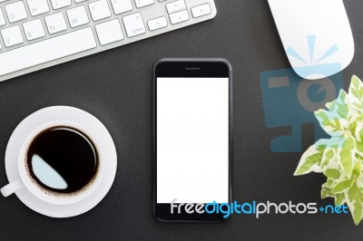 Phone Blank Screen On Work Table Top View Stock Photo