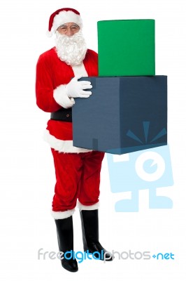 Photo Of Happy Santa Claus Delivering Gifts Stock Photo