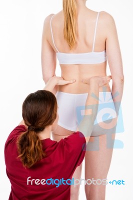 Physiotherapist Doing Back Evaluation Stock Photo