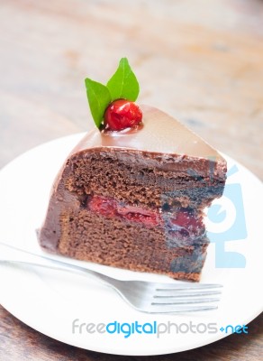 Piece Of Chocolate Cake On White Plate Stock Photo