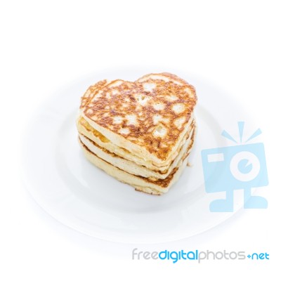 Pile Of Heart Shaped Pancakes On White Plate Stock Photo