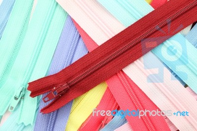 Pile Of Multiple Color Zippers Stock Photo