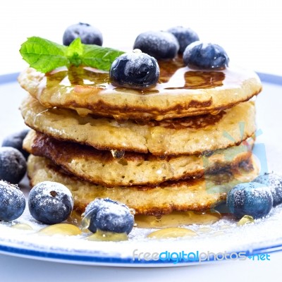Pile Of Pancakes With Blueberries Sprinkled With Icing Sugar And… Stock Photo