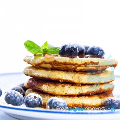 Pile Of Pancakes With Blueberries Sprinkled With Icing Sugar And… Stock Photo