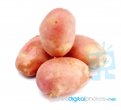 Pile Of Pink Potatoes On White Background Stock Photo