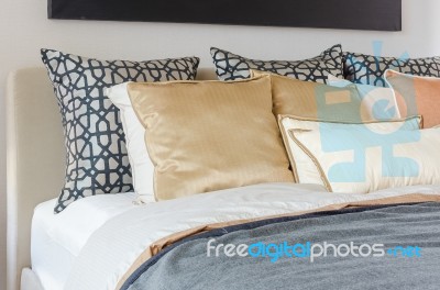 Pillows On Modern Bed With Grey Blanket Stock Photo