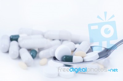 Pills And Tablets On Spoon Stock Photo