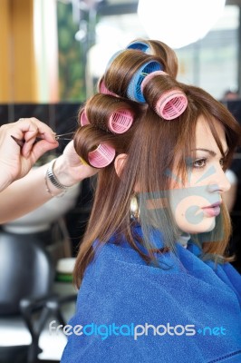 Pinching Client's Curlers Stock Photo
