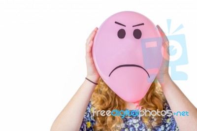 Pink Balloon With Expression In Front  Of Girls Face Stock Photo