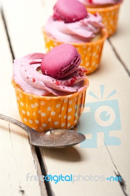 Pink Berry Cream Cupcake With Macaroon On Top Stock Photo