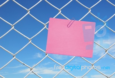 Pink Note On Chain Link Fence Stock Photo