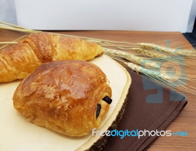 Plain And Chocolate Croissant On Wooden Board, Rustic Background… Stock Photo