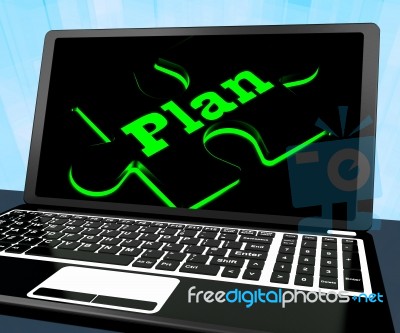Plan Puzzle On Laptop Shows Missions Stock Image