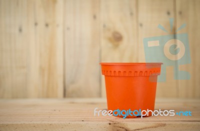 Plastic Orange Plant Pot Stock Photo