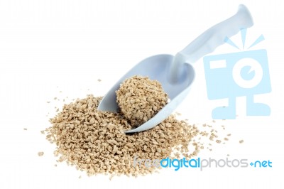 Plastic Scoop For Cleaning Cat Litter And A Pile Of Filler On A Stock Photo